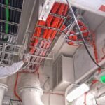 Cable coating technician applying cable coating