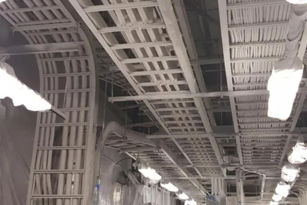 Hydrocarbon-rated cable coating on cable trays in an industrial ceiling
